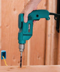 Three Eighths Inch Drill With 4.9 Amp Motor, Variable Speed 0 to 2500 RPM in use on wooden surface