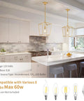 Industrial Gold Lantern Pendant Light With Iron Cage E26 Chandelier installed above a modern kitchen island, gold geometric frame