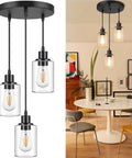 Industrial Three Light Pendant Light With Adjustable Height Up To 34 Inches, Black Finish And Clear Glass Shade, kitchen view