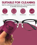Front view of Basesit pink eyeglasses cleaning cloth, 4-pack; hand holding cloth next to black-rimmed glasses.
