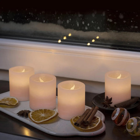 Pink Marble Real Wax Flameless Candles Votive Set With Gentle LED Flicker 2 Inch Wide By 2.2 Inch High 6 Pack in cozy setting