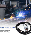 Heavy Duty 300 Amp Grounding Welding Earth Clamp Clip With 10-25 Plug Connector For MIG TIG Machines on workbench with sparks.