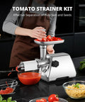 Heavy Duty Electric Meat Grinder With Strainer And Tomato Sauce Press Maker, stainless steel, preparing fresh tomatoes in kitchen.