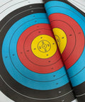 Pro Grade Backyard Archery Target Paper 20 Pack 23.6 Inch 10 Ring Face colorful bullseye target layers close-up.