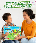 Hands On DIY Mini Golf STEM Kit For Kids Ages Six To Twelve Build A 10 Hole Course With A Mechanical Golfer Windmill Pop Up Trees Shots Counter And Champion Trophy No Tools Needed Screen Free Fun That Teaches Real Engineering. Boy and woman holding Mini Golf STEM kit box