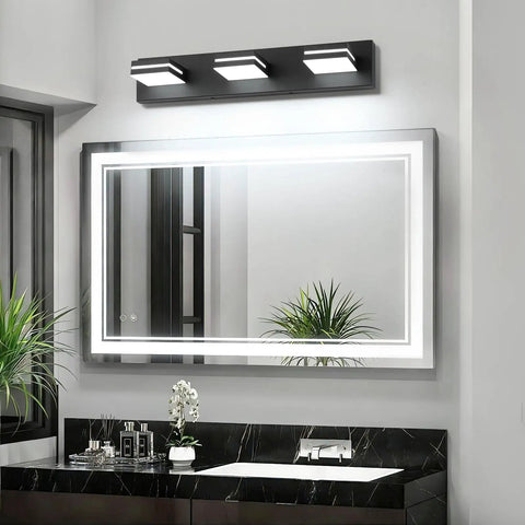 Three Light 24 Inch Matte Black LED Vanity Light With Frosted Acrylic Shades, Cool White 6000K For Bathroom Mirror, Moisture Proof Wall Fixture, Non Dimmable Modern Style installed above a bathroom mirror