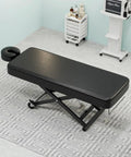 Paddie Flat Electric Lift Massage Table Professional Spa Bed With 6.7 Inch Memory Foam Adjustable Face Cradles And Rolling Wheels in black.