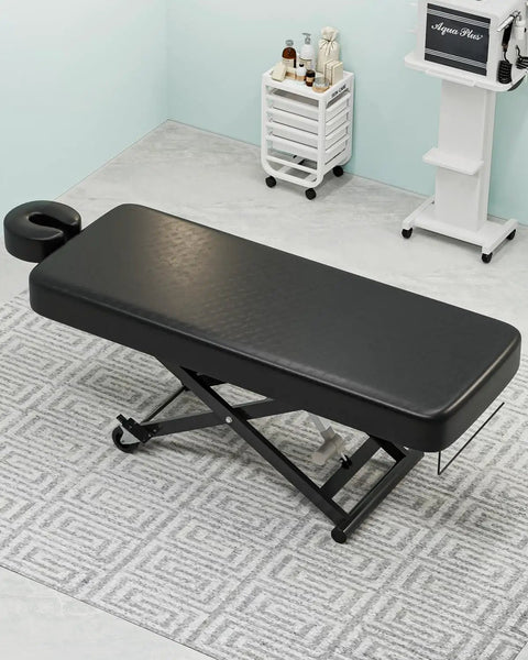 Paddie Flat Electric Lift Massage Table Professional Spa Bed With 6.7 Inch Memory Foam Adjustable Face Cradles And Rolling Wheels in black.