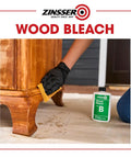 Game Changing Two Step Wood Bleach Kit For Interior Wood to brighten stripped surfaces, with a user applying bleach on furniture.