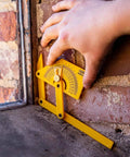 Hand using Handy Plastic Protractor And Angle Finder Set For Inside Outside And Sloped Angles 0 To 180 Degrees Four Piece With Brass Lock