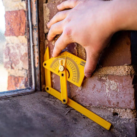 Hand using Handy Plastic Protractor And Angle Finder Set For Inside Outside And Sloped Angles 0 To 180 Degrees Four Piece With Brass Lock