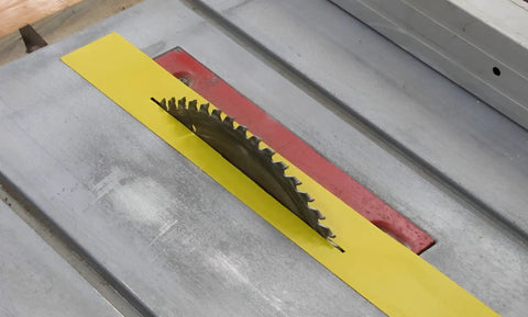Top Shelf Zero Clearance Tape For Nail The Cut Precision And Crispy Clean Edges On Miter Or Table Saws with yellow PVC on saw.