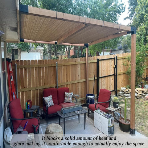 Patio with mocha 12x20 ft sun shade cloth pergola, 90% UV block, creating cool shaded area with red chairs underneath.