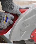 Person using Heavy Duty Cut Resistant Work Gloves Featuring Level 5 Soft Armor And Grippy Reinforced Palms, gripping a tool.