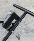 Close-up of handle and control panel of Pro Push Broadcast Spreader 85 Lb Capacity With Durable Plastic Hopper for lawn care.