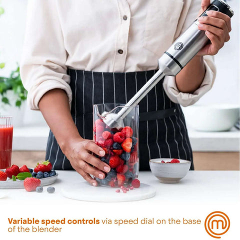 Professional Handheld Immersion Blender Featuring Powerful 400W Motor And Durable Stainless Steel Shaft Perfect For Creamy Soups Rich Sauces And Quick Daily Meal Prep Blends Effortlessly Like A Real Deal Kitchn Champion using variable speed controls on mixed berries.
