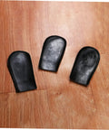 Three black Six Pack Piano Pedal Protective Covers Soft Leather Foot Pad Sleeves for Acoustic and Digital Pianos on wood floor