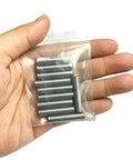 Hand holding pack of Quarter Inch By One And One Quarter Inch Dowel Pins 10 Pack, Metal Shelf Pegs For Shelves And Supports in bag