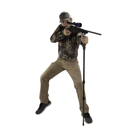 Hunter using Carbon Fiber Shooting Stick Monopod With Adjustable Cams for Precision Long-Range Shooting in a standing position.