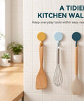 15 Pack Self Adhesive Wall Hooks With Hella Strong Grip No Drilling Damage Free Mounting For Towels Keys And Flatware Decorative Cutesy Style Perfect For Bathroom Office Or Closet Super Easy Setup And A Surefire Storage Winner holding kitchen utensils on a tiled wall.