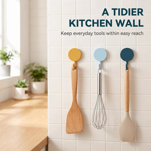 15 Pack Self Adhesive Wall Hooks With Hella Strong Grip No Drilling Damage Free Mounting For Towels Keys And Flatware Decorative Cutesy Style Perfect For Bathroom Office Or Closet Super Easy Setup And A Surefire Storage Winner holding kitchen utensils on a tiled wall.
