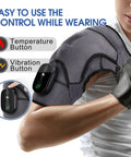 Cordless Shoulder Heating Pad With Vibration Massage worn by person, showing temperature and vibration control buttons.