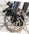 Heavy Duty Front And Rear Mechanical Disc Brake Pad Upgrade For Mountain Bikes Featuring Forged Aluminum Frames And Chunky Sintered Pads For Killer Stopping Power Easy Tweaks And Dependable Trail Performance All Around - close-up of front mechanical disc brake with aluminum caliper and sintered pad.