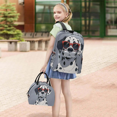 Child holding Dalmatian Print Backpack with Insulated Lunch Cooler, showing design and functionality outdoors.