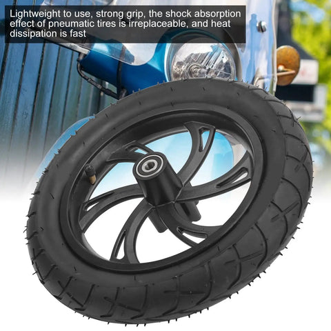 12 Inch Electric Scooter Tire With Wheel Hub Rubber Tyre Replacement 12 1/2 X 2 1/4 in front of blue scooter