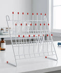 Durable Metal Lab Beaker Drying Holder And Test Tube Rack Draining Stand For Glassware Organization 11x11 Inch with red tips.