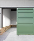 Heavy Duty 10 Foot Galvanized Outdoor Sliding Barn Door Hardware Kit With 450 Lb Capacity Exterior Track System installed on green door