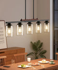 Straight Up Modern Farmhouse 5 Light Dining Room Chandelier With Dope Seeded Glass Shades Galvanized Steel Island Ceiling Fixture Lighting Top Shelf Kitchen Vibes over dining table with glowing lights.
