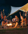 Six Pack Metal Citronella Torches For Outdoor Use 60 Inch Black Garden Yard Lights with people around campfire at night