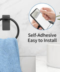 Adhesive Towel Ring For Bathroom No Drilling Install Easy Mount Hand Towel Holder, with blue towel, next to a white sink.