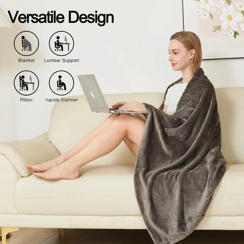 Woman using 2 In Go Everywhere Travel Blanket Pillow Micro Plush Flannel Cozy Compact For Airplane And Car Office And Home Use Ultra Soft Sleep Pillow For Travel Essentials Gray while sitting on a couch with a laptop.
