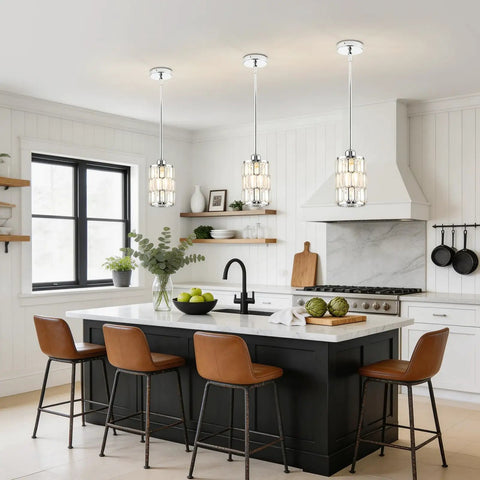 etiruety Adjustable Modern Crystal Chrome Pendant Lights Kitchen Island above a marble countertop with brown bar stools.