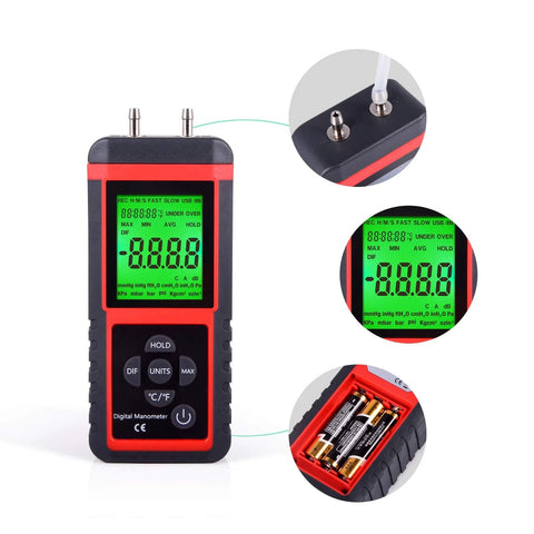 Digital manometer with dual top ports, green backlit display, red and black housing, handheld.
Close-up of dual ports on top of digital manometer with attached tubing.
Close-up of bright green LCD showing measurements on the digital manometer.
Battery compartment open showing AA cells inside red-and-black handheld manometer.