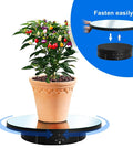 Ultimate 3 In 1 Motorized Rotating Display Stand With 360 Degree Electric Turntable and swappable covers holding a potted plant.
