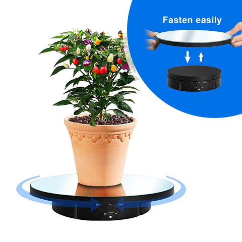 Ultimate 3 In 1 Motorized Rotating Display Stand With 360 Degree Electric Turntable and swappable covers holding a potted plant.
