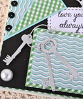 9 Piece Vintage Keys Metal Cutting Dies Set for Scrapbooking and Card Making displayed on a craft card with decorative paper