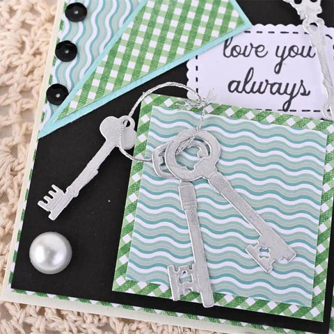 9 Piece Vintage Keys Metal Cutting Dies Set for Scrapbooking and Card Making displayed on a craft card with decorative paper