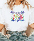 Tintnut Grungy Watercolor Heat Transfer Vinyl 12Pcs Iron On Glitter Sheets Neon Hues For Custom T Shirts And Fabric Projects Creative Crafts on white tee with 'Beach Squad' design.