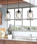 Black Glass Pendant Lights Two Pack With Clear Glass Cylinders, Industrial Farmhouse Cage Hanging Lights in kitchen