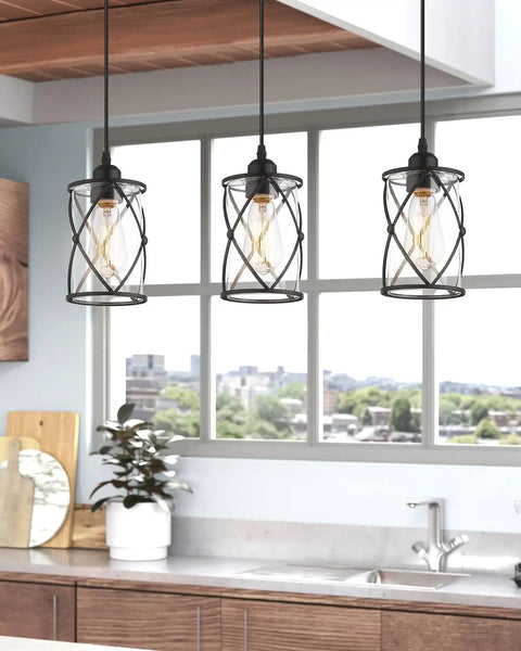 Black Glass Pendant Lights Two Pack With Clear Glass Cylinders, Industrial Farmhouse Cage Hanging Lights in kitchen