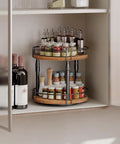 Smooth Spin Two Tier Lazy Susan Spice Rack Organizer With Adjustable Height For Kitchen Counter And Cabinet Storage Rustic Brown Finish featuring spices and wine bottles in a cupboard.