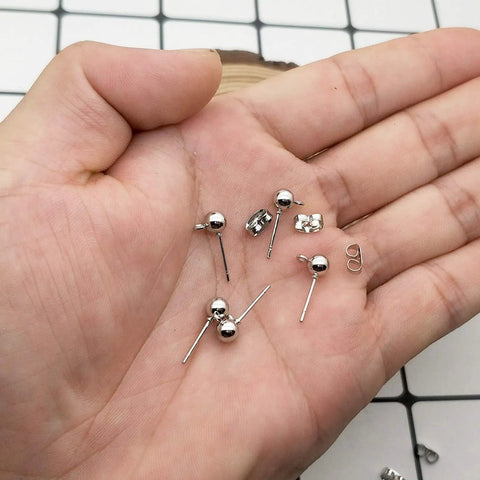 100 Pcs White K Ball Earring Studs With Loop Backs Hypoallergenic Posts For Jewelry Making Craft Projects And DIY Earring Supplies Ideal For Custom Studs Hoops Bead Jewelry And Creative Jewelry, silver ball studs in hand
