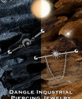 Dope Industrial Piercing Jewelry 316L Surgical Steel Barbell With Clear CZ Moon Dangle shown on contrasting background