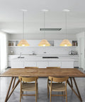 Kiven Instant Light Conversion Kit for 4/5/6inch Hole, 1-Light glass lighting fixtures installed above a modern kitchen table.