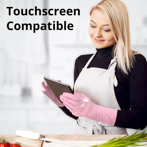 Top Shelf Disposable Nitrile Dish Gloves With Extended 12 Inch Cuff, 6 Mil Thick Guard, Cherry Blossom Print, Latex Free, Straight Up Reliable For Deep Cleaning And Hair Dye, Box Of 100 worn by a woman using a tablet.