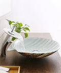 USZWBY Bathroom Vessel Sink Tempered Glass Bathroom Vessel Sink Shell Shape Above Counter with faucet and water flow.